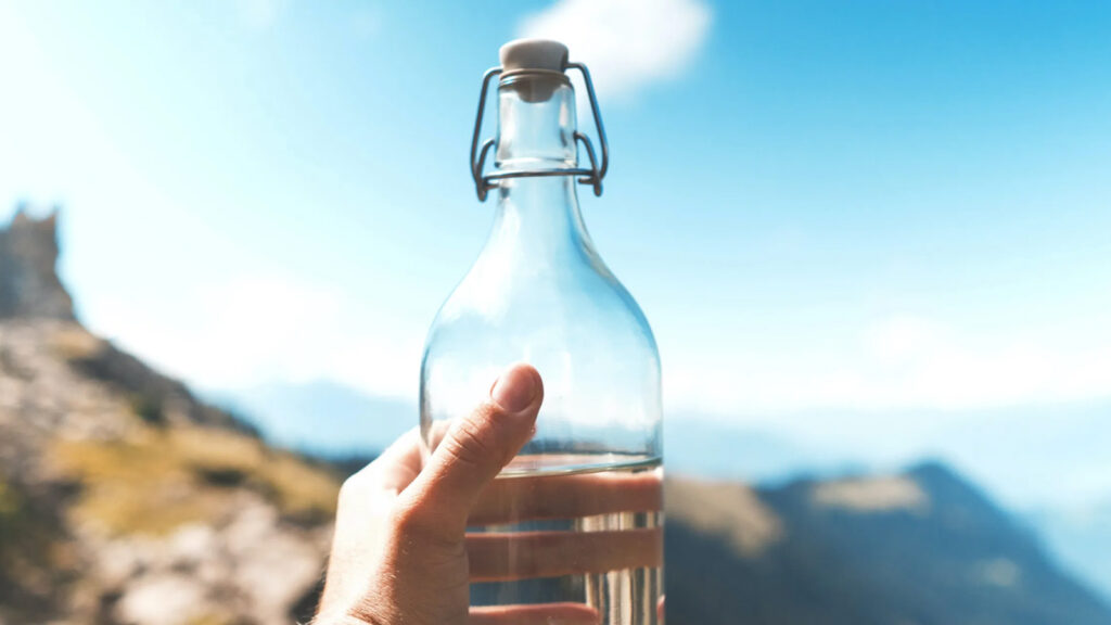 clear glass water bottle against the sky