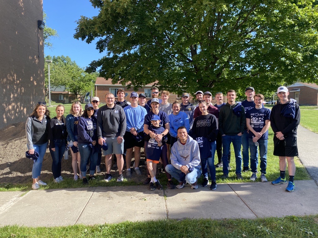 O-I interns and employees work with the Lucas Metropolitan Housing on beautification projects, including mulching, planting flowers and painting.